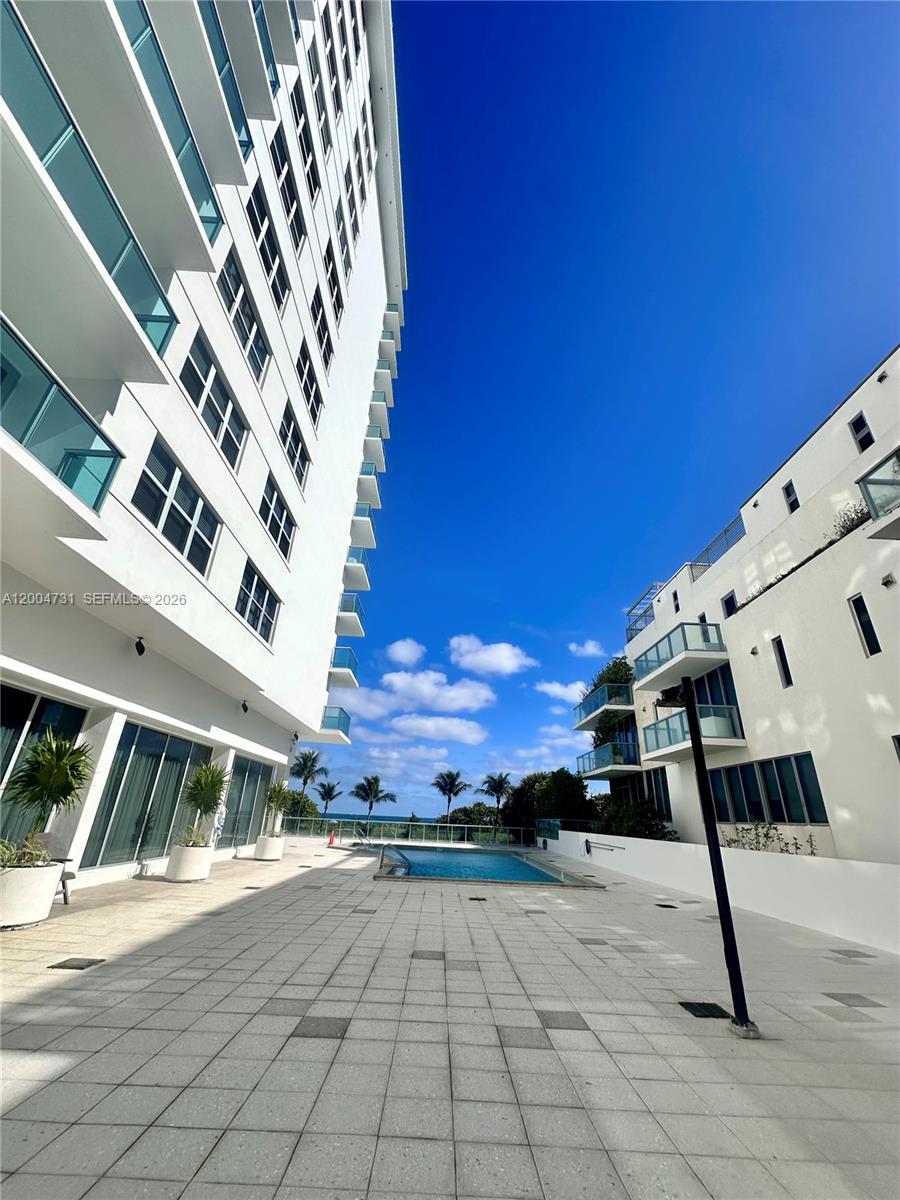 9511 Collins Avenue, Unit 1001 Surfside, FL 33154 - Photo 28 of 34 a view of an outdoor space with porch