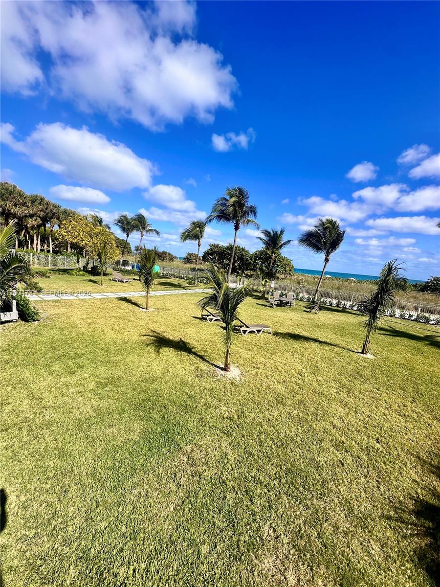 9511 Collins Avenue, Unit 1001 Surfside, FL 33154 - Photo 30 of 34 a view of an ocean and beach