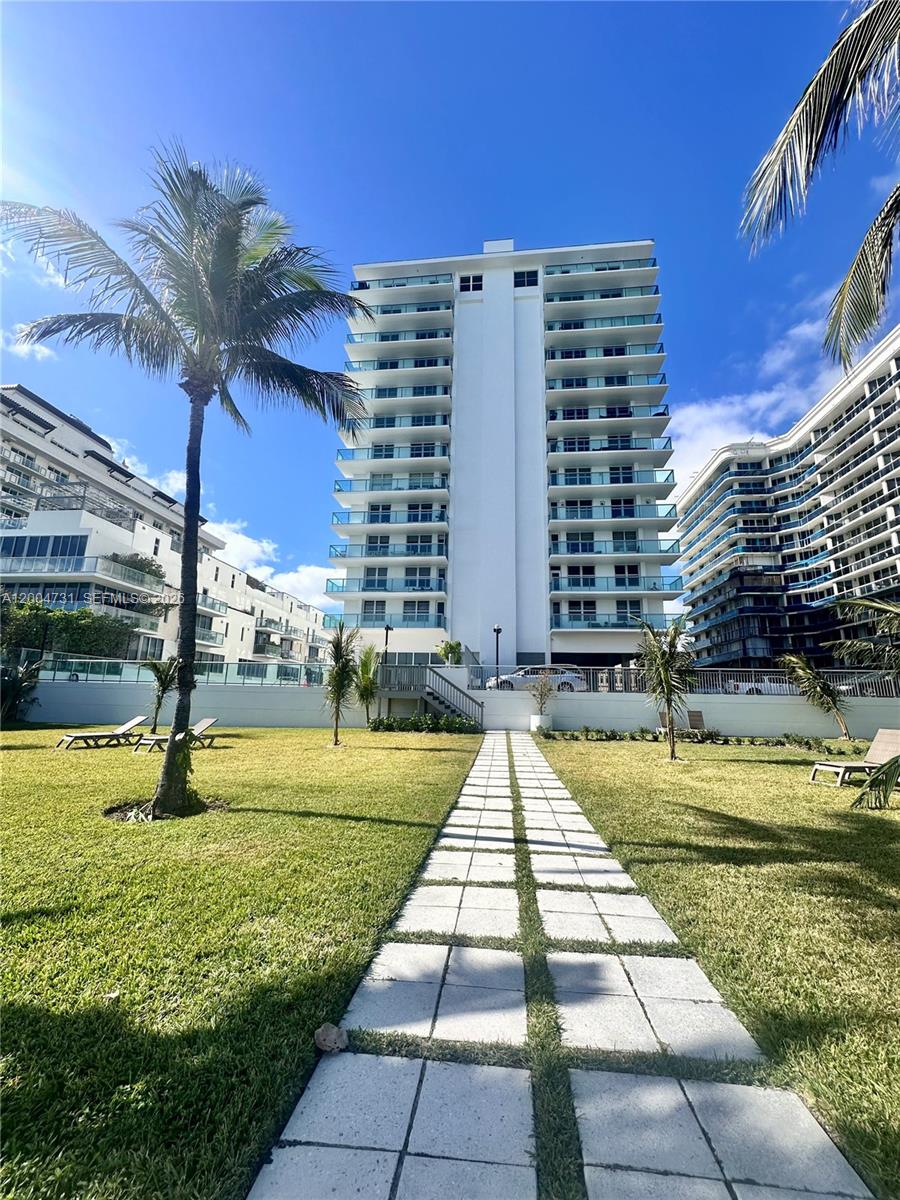 9511 Collins Avenue, Unit 1001 Surfside, FL 33154 - Photo 32 of 34 a view of swimming pool with a yard