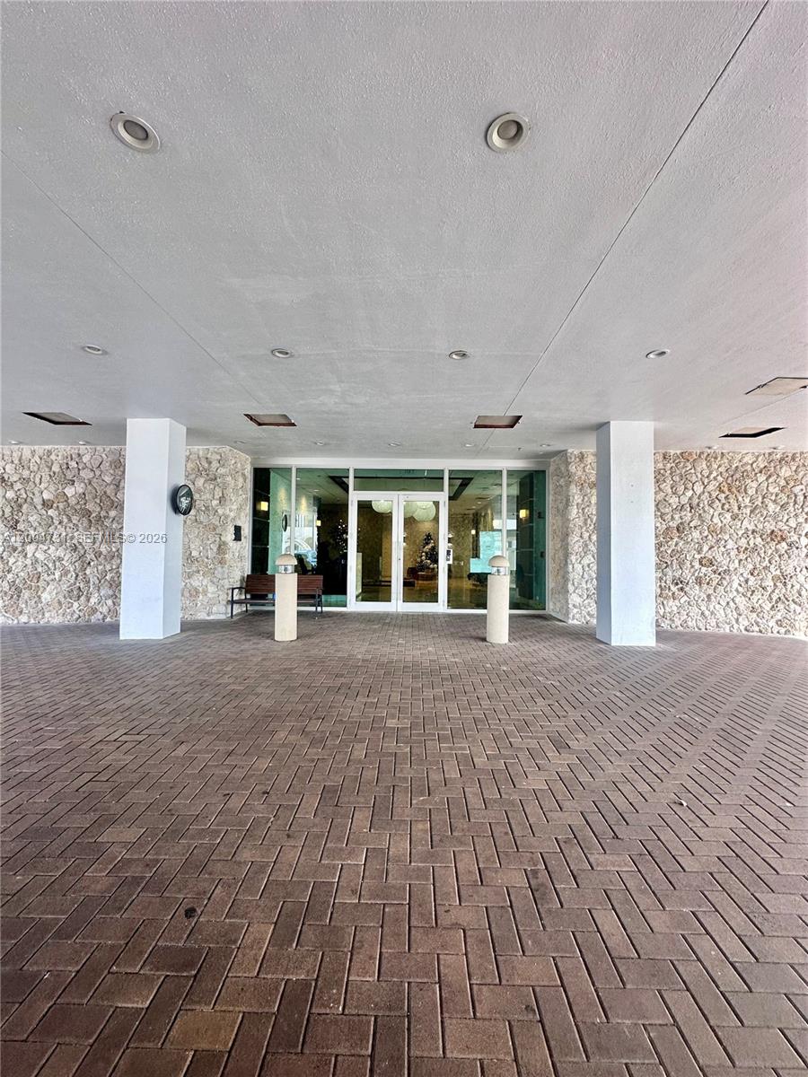 9511 Collins Avenue, Unit 1001 Surfside, FL 33154 - Photo 5 of 34 a view of a big room with wooden floor and windows