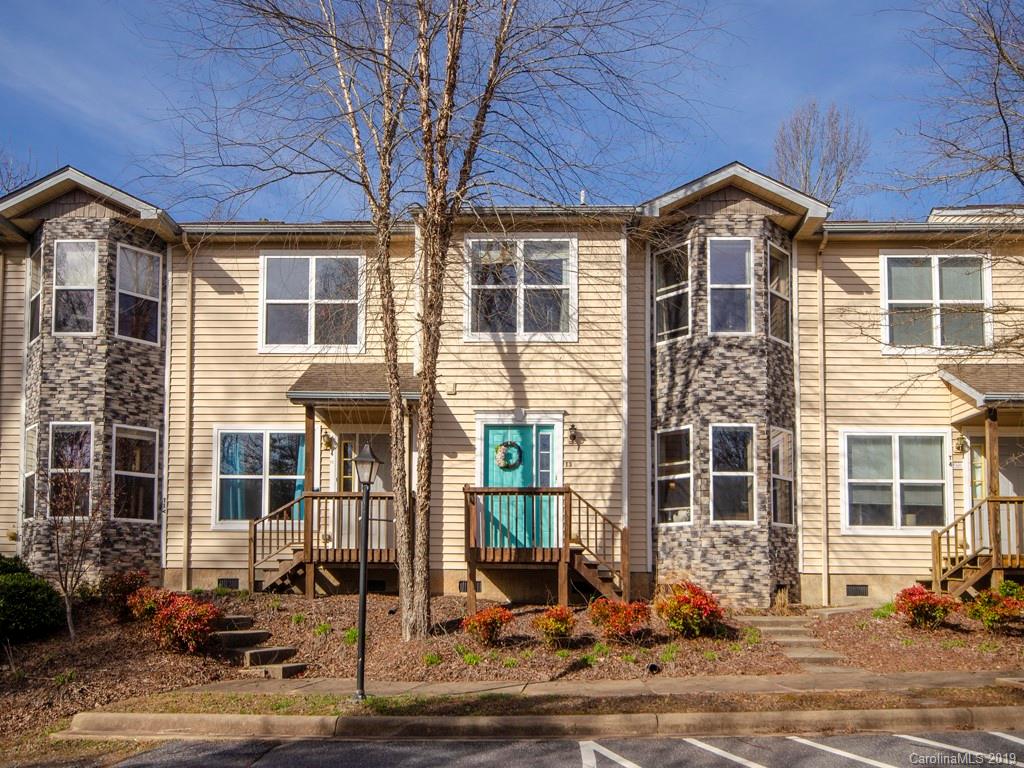30 North Ridge Point, Unit T3 Sylva, NC 28779 - Photo 1 of 18 a front view of a house with a garden