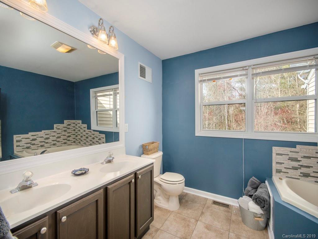 30 North Ridge Point, Unit T3 Sylva, NC 28779 - Photo 12 of 18 a bathroom with a sink toilet and window