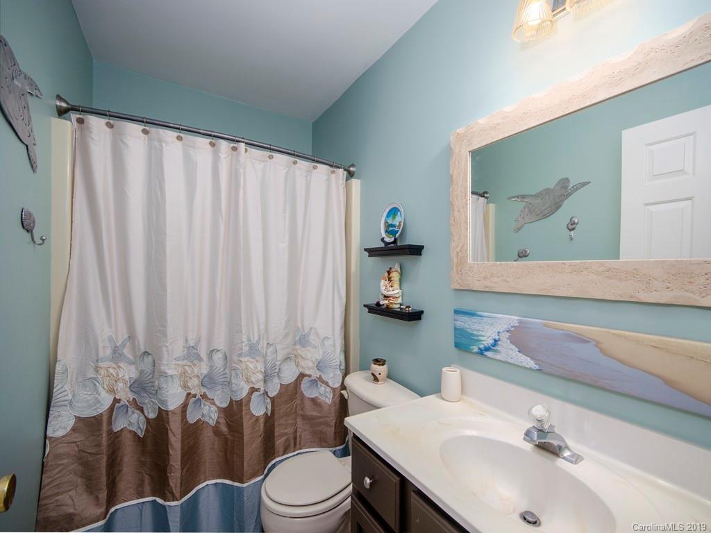30 North Ridge Point, Unit T3 Sylva, NC 28779 - Photo 15 of 18 a bathroom with a sink a toilet and a mirror