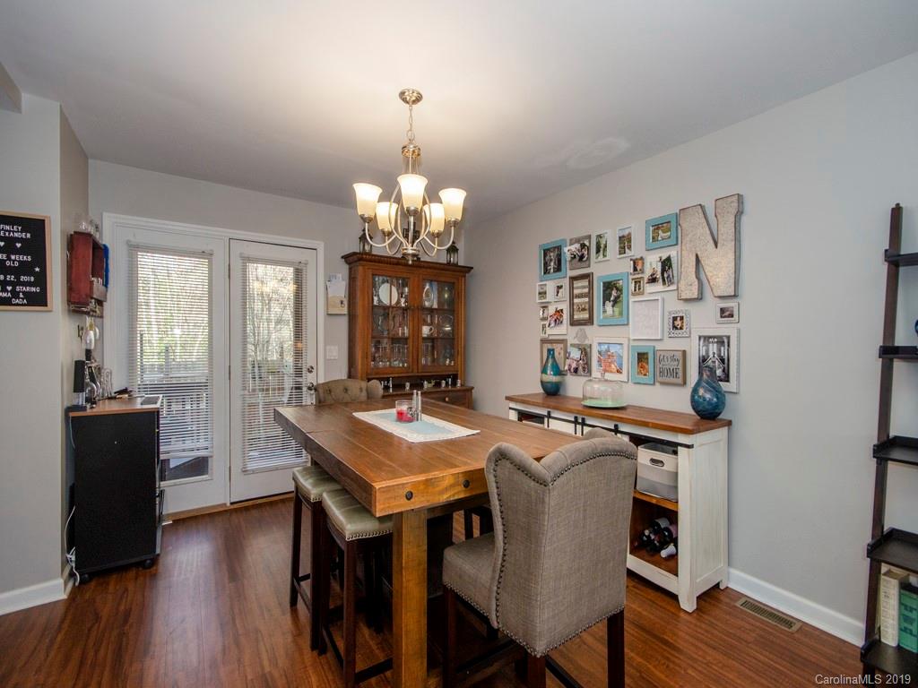 30 North Ridge Point, Unit T3 Sylva, NC 28779 - Photo 6 of 18 a view of a dining room with furniture window and wooden floor