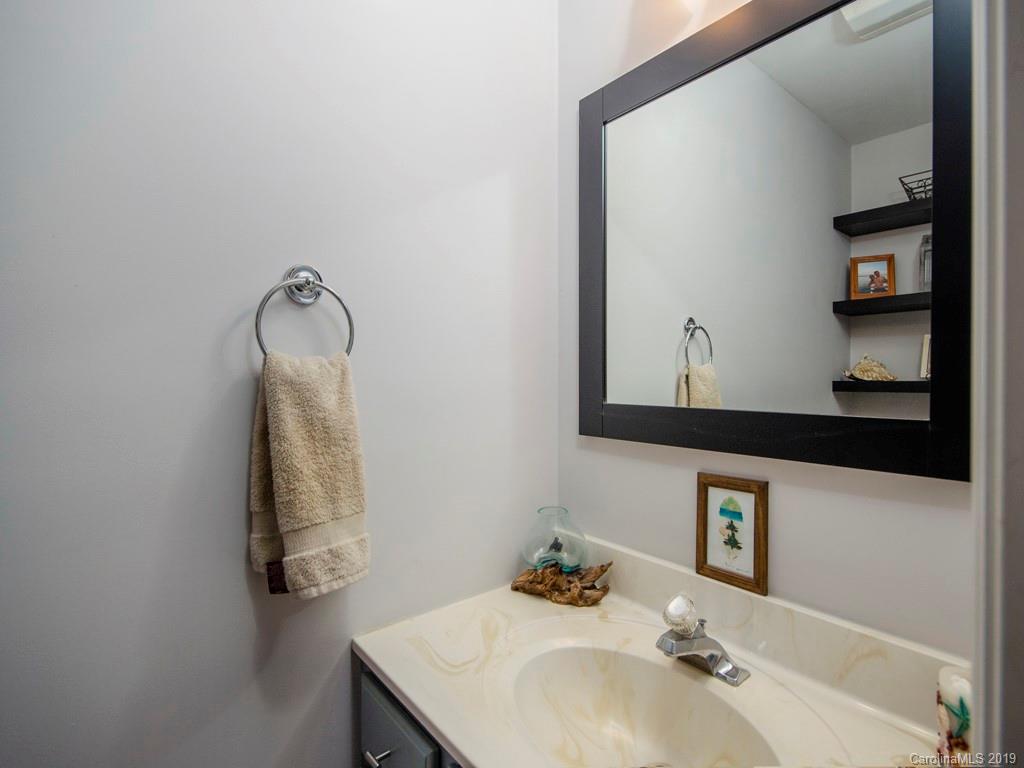 30 North Ridge Point, Unit T3 Sylva, NC 28779 - Photo 10 of 18 a bathroom with a sink vanity and mirror