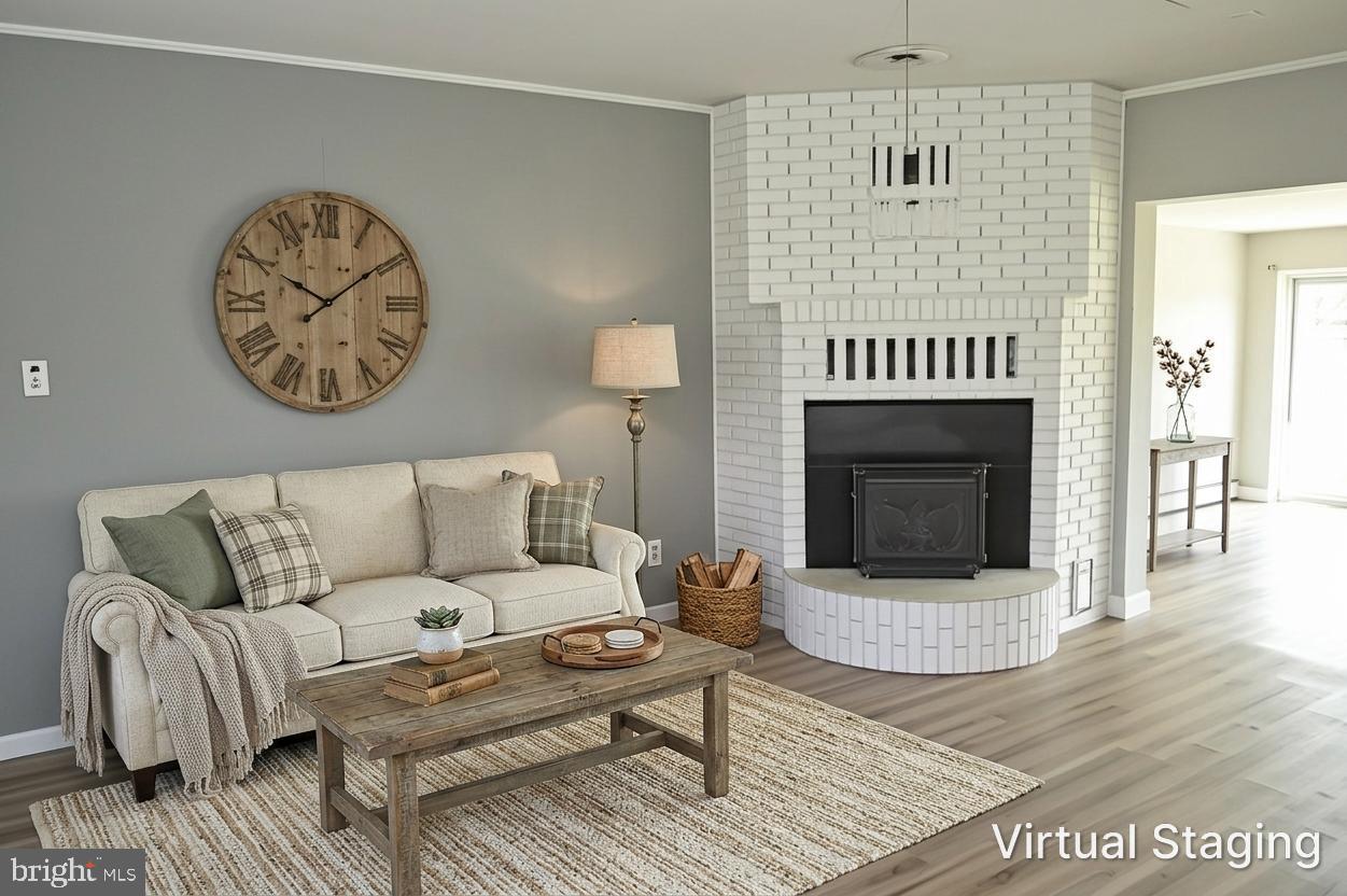 2051 Stover Road Taneytown, MD 21787 - Photo 14 of 44 a living room with furniture a fireplace and a window