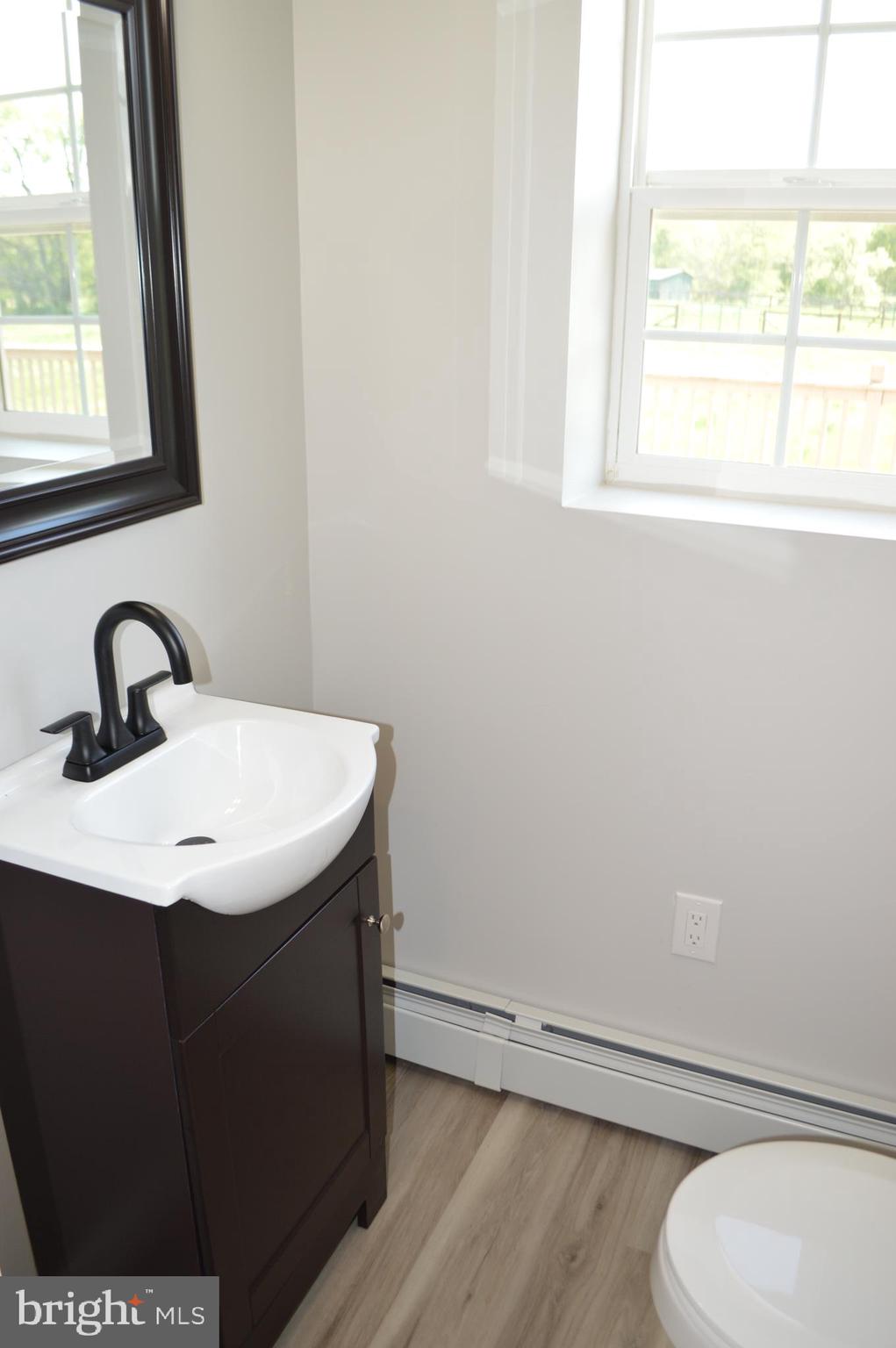2051 Stover Road Taneytown, MD 21787 - Photo 21 of 44 a bathroom with a sink and a toilet