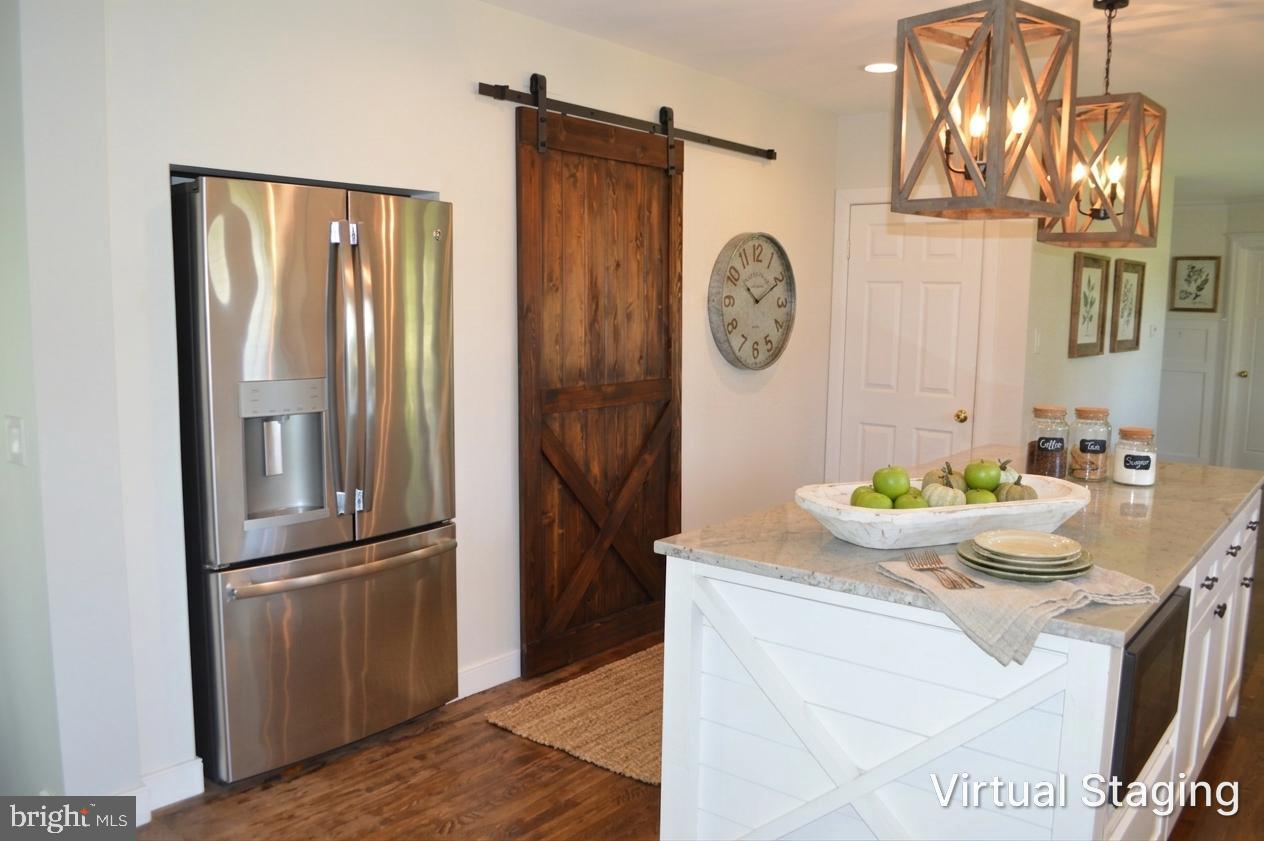 2051 Stover Road Taneytown, MD 21787 - Photo 27 of 44 a kitchen with stainless steel appliances granite countertop a refrigerator and a stove