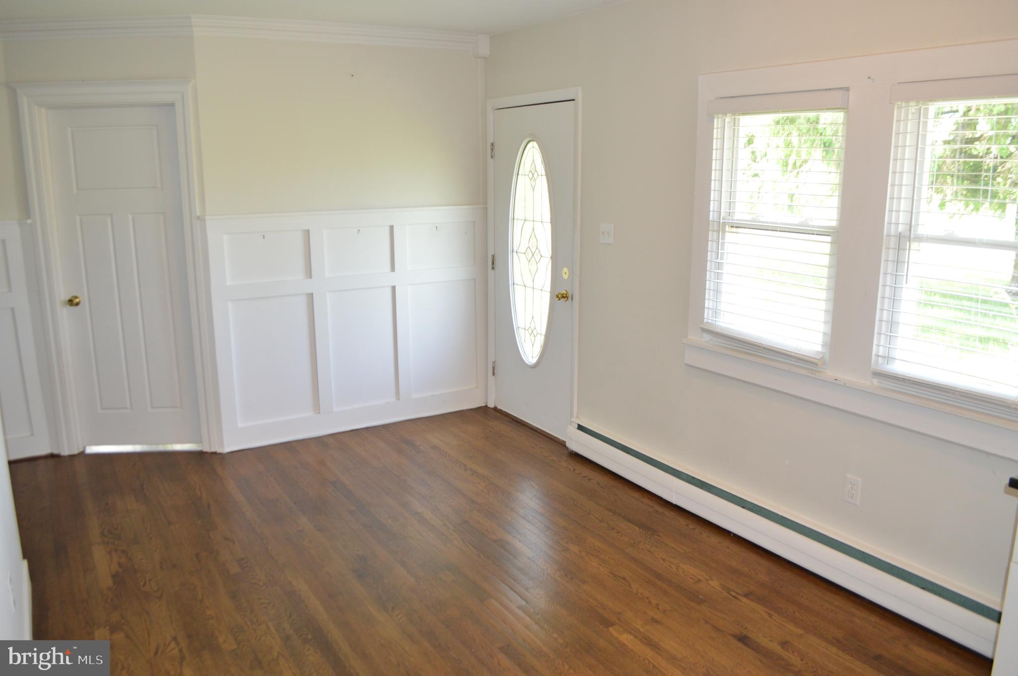 2051 Stover Road Taneytown, MD 21787 - Photo 30 of 44 an empty room with wooden floor and windows