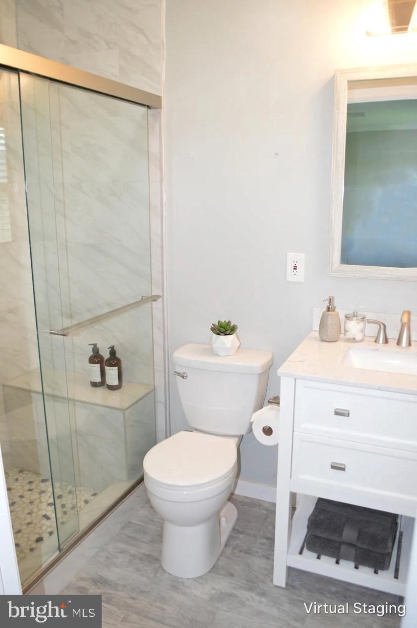 2051 Stover Road Taneytown, MD 21787 - Photo 33 of 44 a white toilet sitting next to a bathroom sink