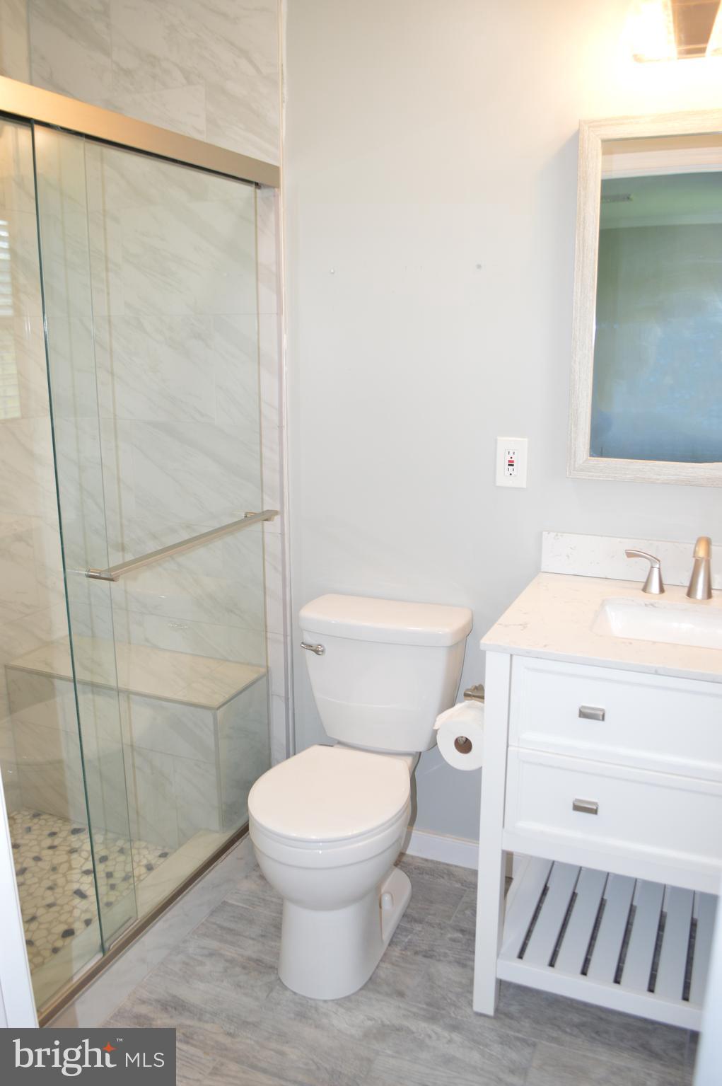2051 Stover Road Taneytown, MD 21787 - Photo 34 of 44 a white toilet sitting next to a bathroom sink