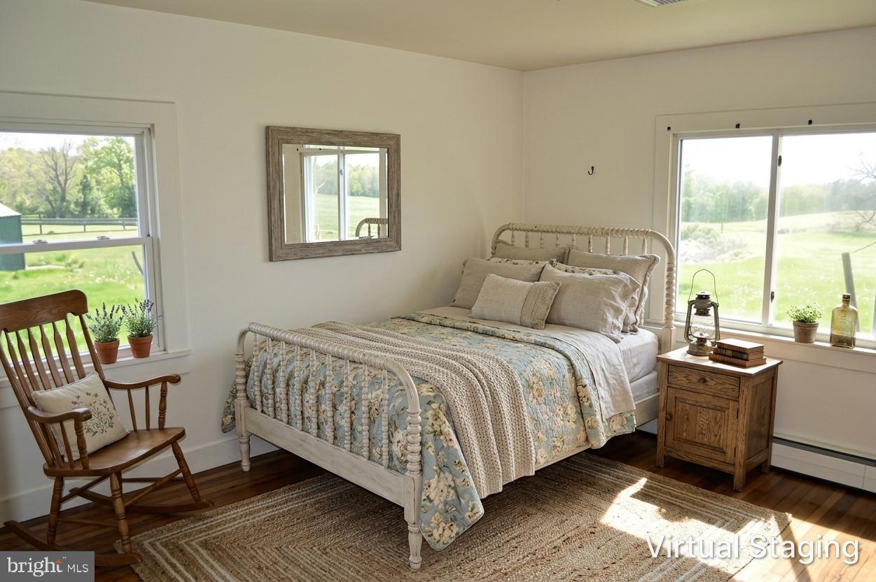 2051 Stover Road Taneytown, MD 21787 - Photo 35 of 44 a bedroom with a bed chair and two large window