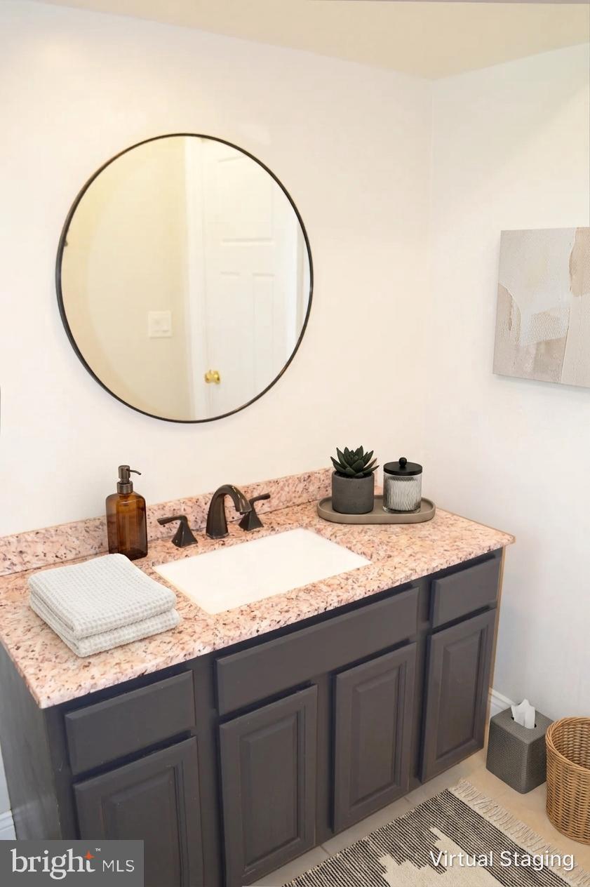 2051 Stover Road Taneytown, MD 21787 - Photo 41 of 44 a bathroom with a granite countertop sink and a mirror