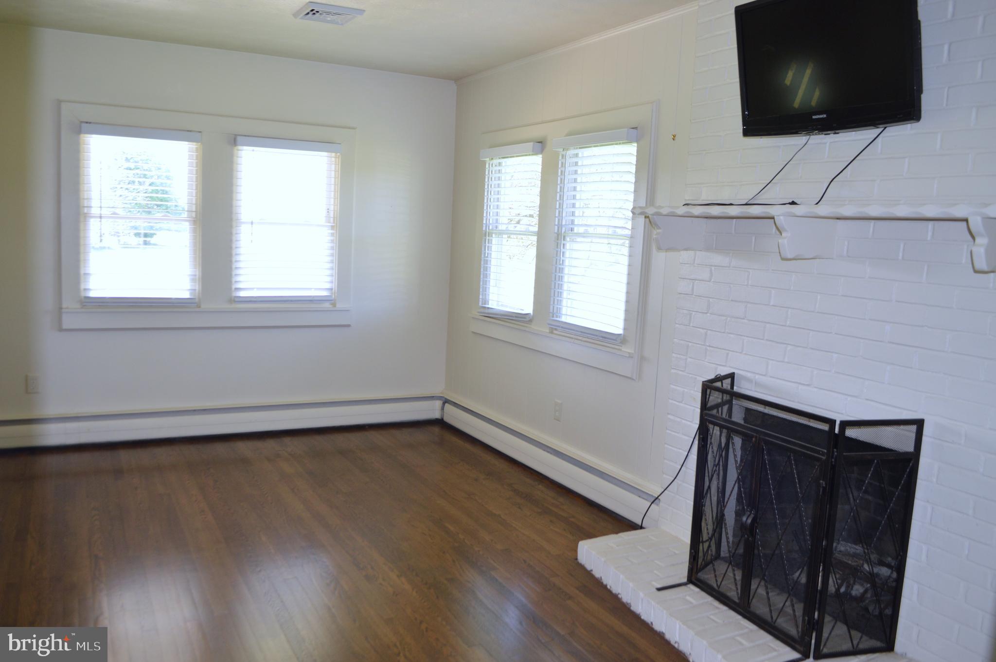 2051 Stover Road Taneytown, MD 21787 - Photo 44 of 44 an empty room with wooden floor and windows