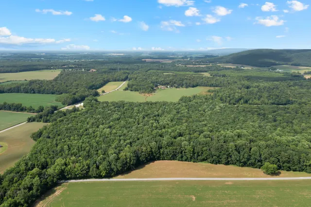 a view of a lake with a yard