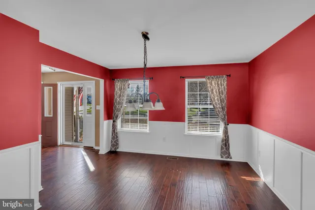 a view of livingroom with furniture wooden floor and windows