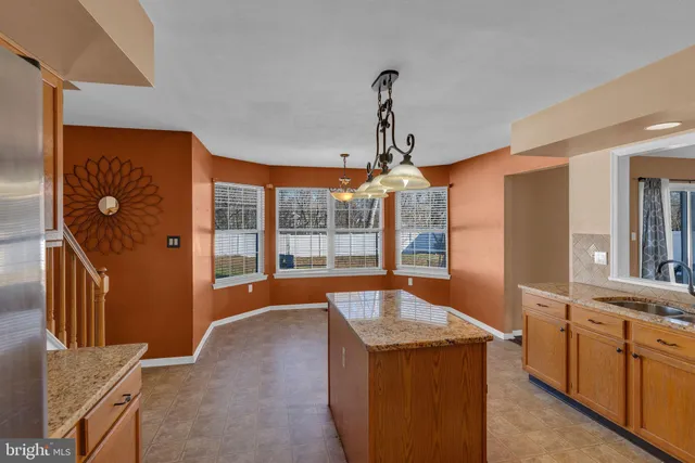 a view of a kitchen with a sink