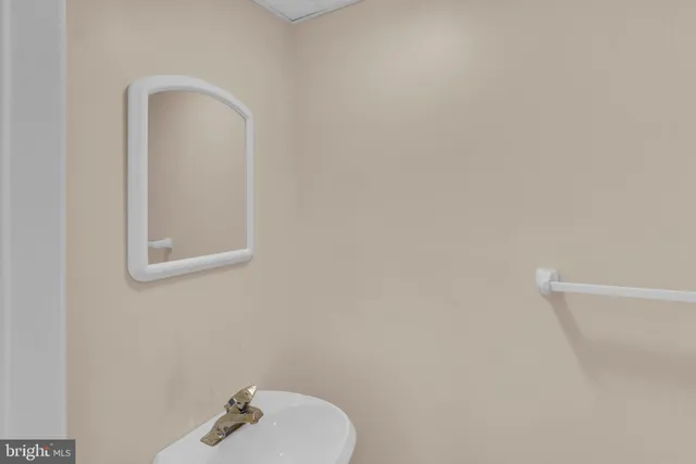 a view of empty room with a fireplace