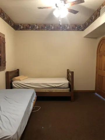 a view of a bedroom with furniture