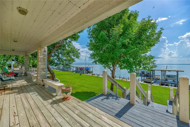 an aerial view of a house with pool a patio and yard