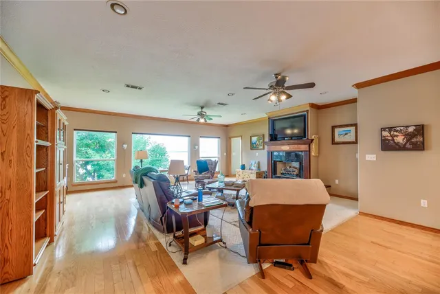 a kitchen with stainless steel appliances kitchen island granite countertop a sink and cabinets