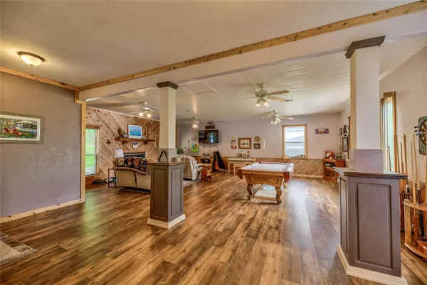 a kitchen with lots of counter top space and wooden floor