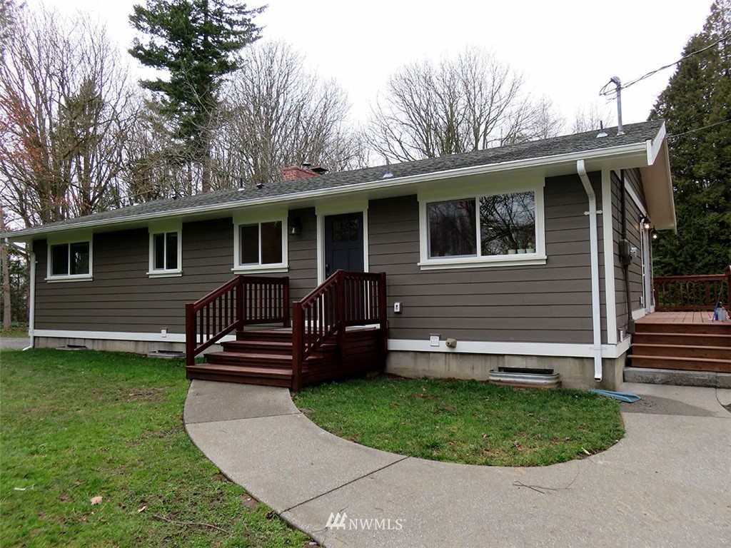 2664 Brown Road Ferndale, WA 98248 - Photo 1 of 16 a front view of a house with a garden