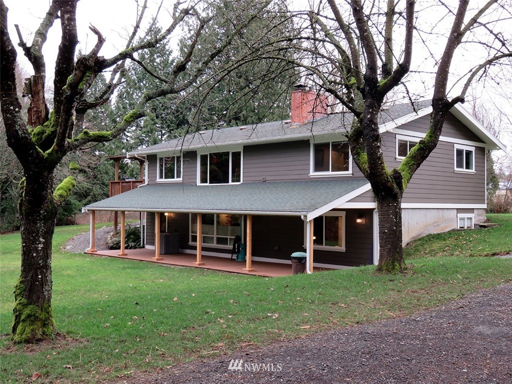 2664 Brown Road Ferndale, WA 98248 - Photo 2 of 16 a front view of a house with garden