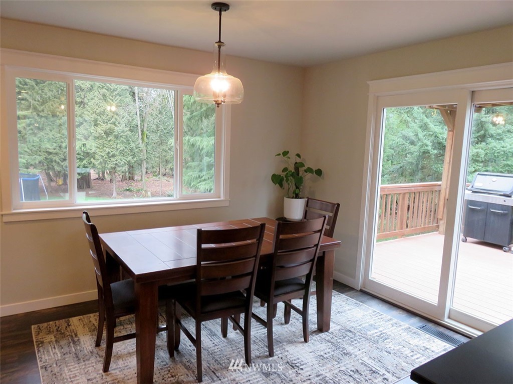 2664 Brown Road Ferndale, WA 98248 - Photo 6 of 16 a view of a dining room with furniture window and wooden floor