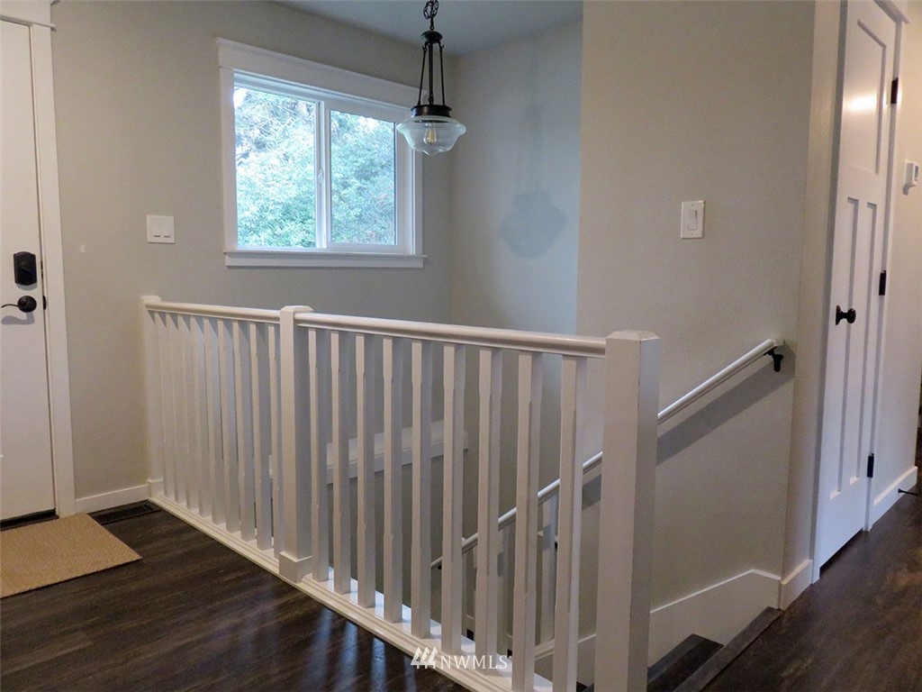 2664 Brown Road Ferndale, WA 98248 - Photo 7 of 16 a view of a hallway with wooden floor and staircase