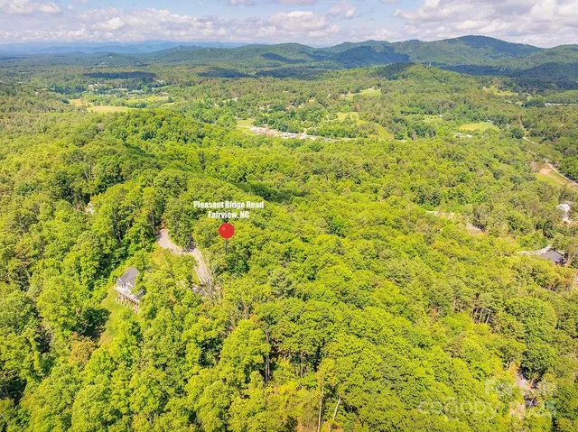 a view of a field with an ocean