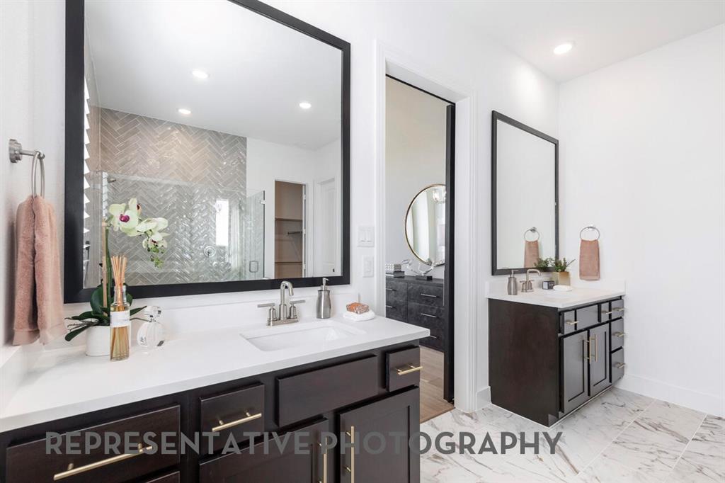 2907 Messenger Street Forney, TX 75126 - Photo 18 of 40 a bathroom with a double vanity sink mirror and