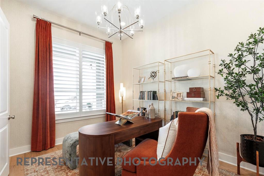 2907 Messenger Street Forney, TX 75126 - Photo 23 of 40 a view of a dining room with furniture and chandelier