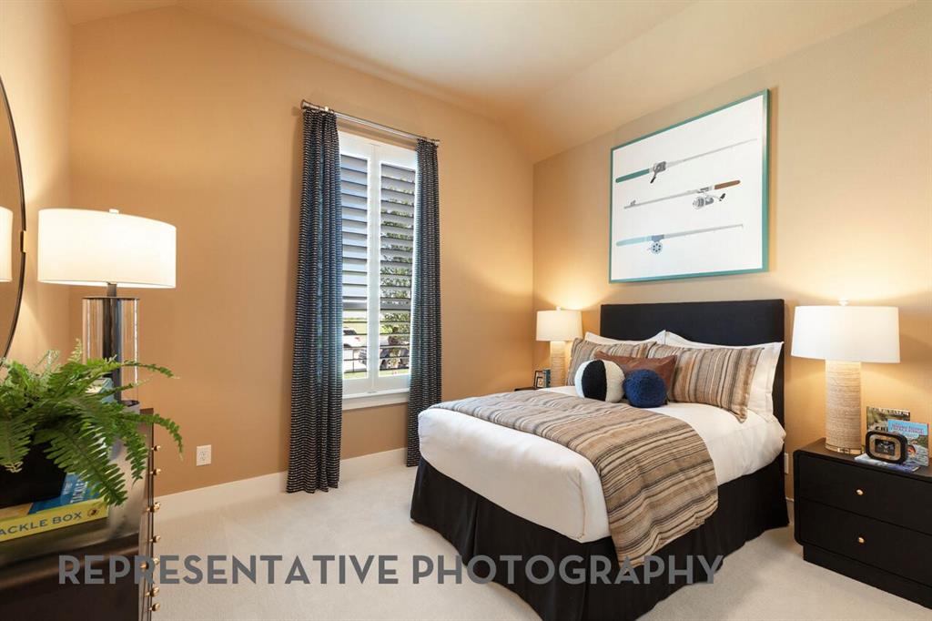 2907 Messenger Street Forney, TX 75126 - Photo 31 of 40 a bedroom with a bed and a night stand