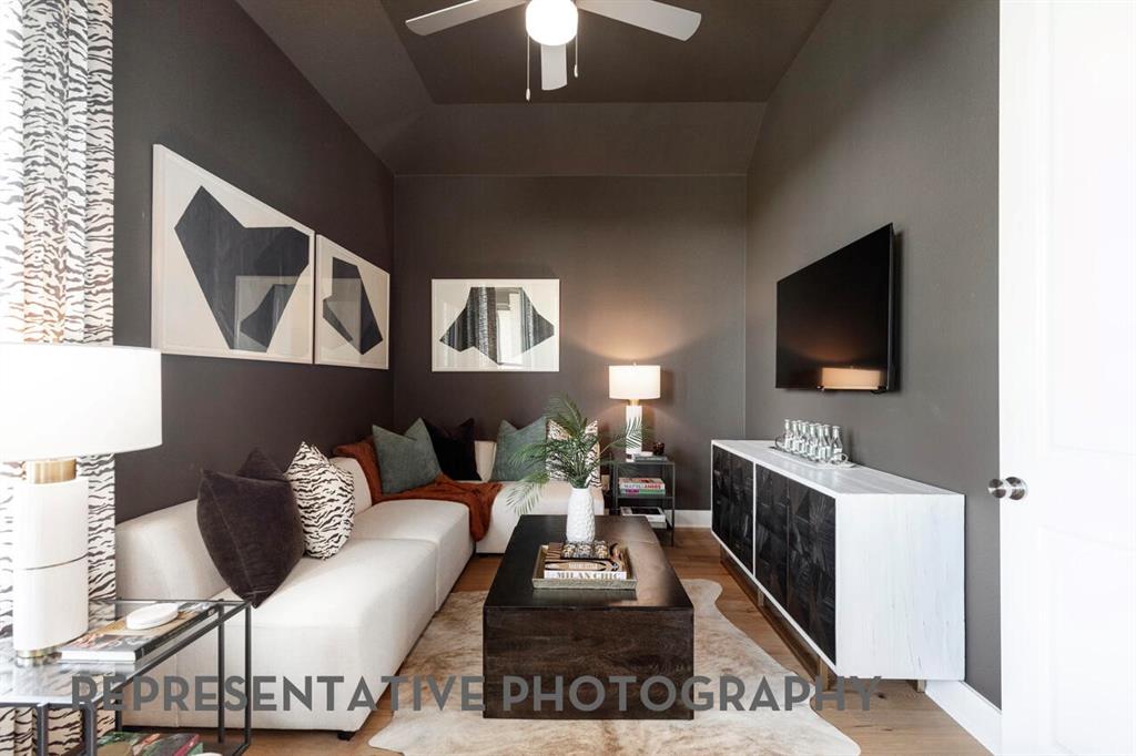 2907 Messenger Street Forney, TX 75126 - Photo 34 of 40 a living room with furniture and a flat screen tv