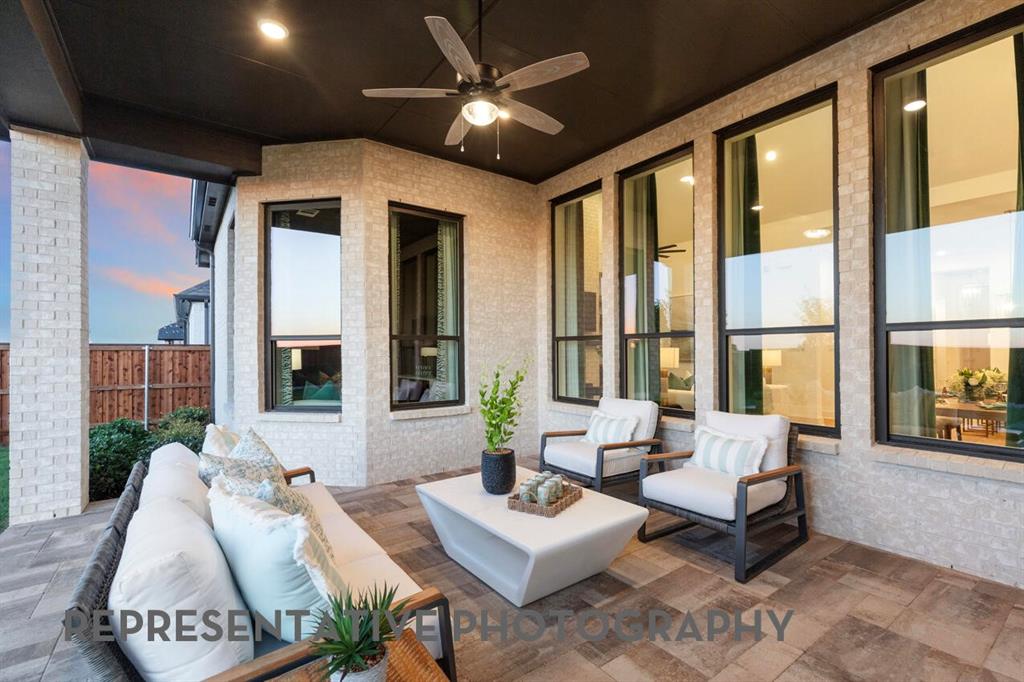 2907 Messenger Street Forney, TX 75126 - Photo 37 of 40 a living room with furniture and floor to ceiling windows