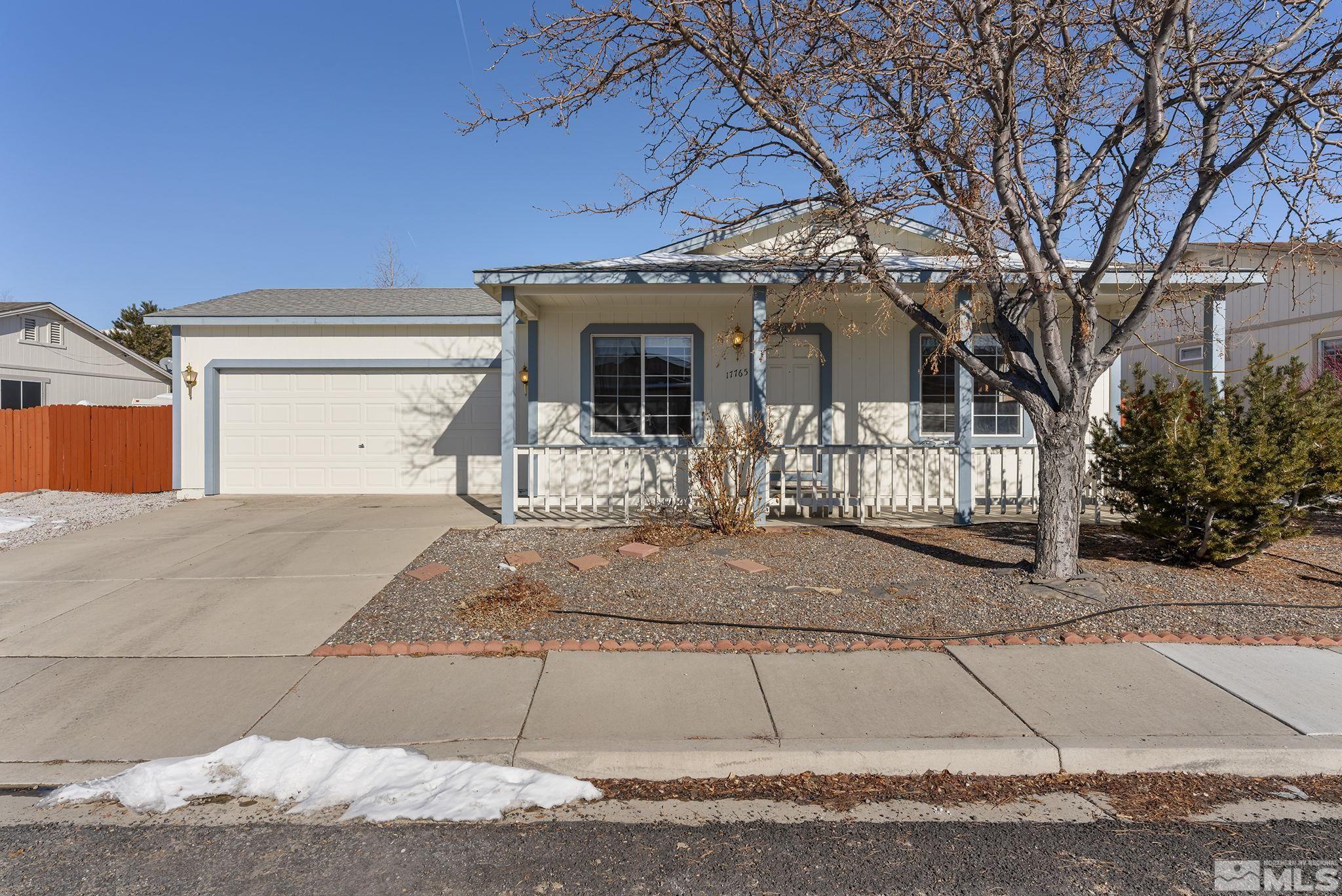 17765 Fortune Court Reno, NV 89508 - Photo 1 of 16 a front view of a house with a yard and garage