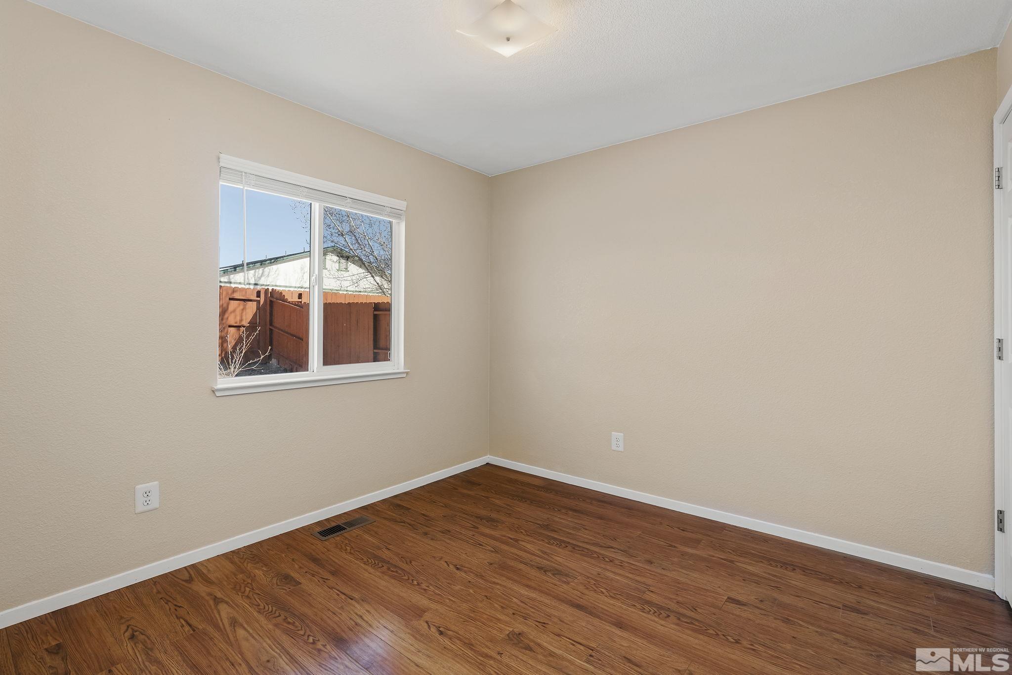 17765 Fortune Court Reno, NV 89508 - Photo 11 of 16 wooden floor in an empty room
