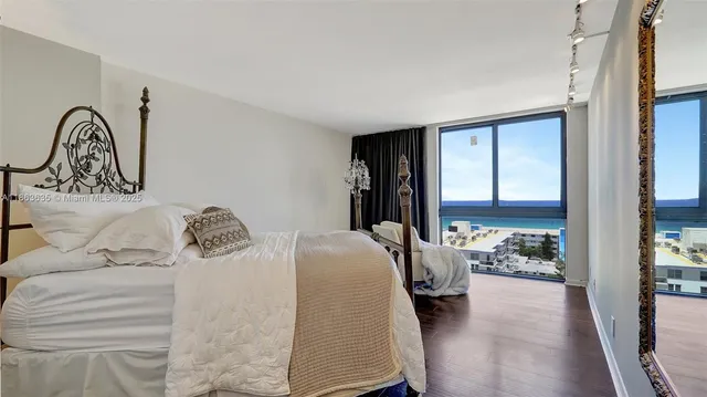 a bedroom with furniture and a window