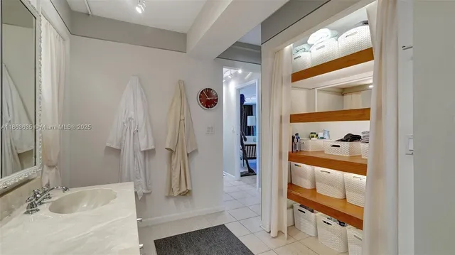 a bathroom with a tub and shower