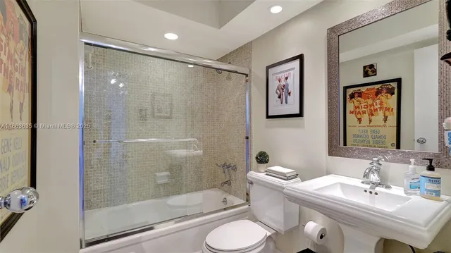a living room with furniture and a book shelf