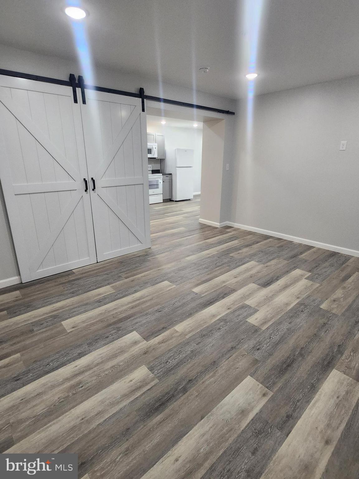 65 Woods Edge Road, Unit 18 Fort Ashby, WV 26719 - Photo 6 of 12 en empty room with wooden floor