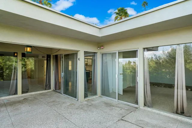 a view of a swimming pool with a patio
