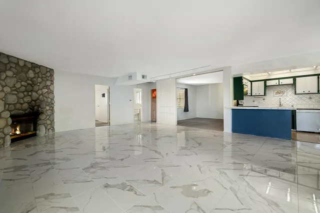 a kitchen with stainless steel appliances a sink and stove