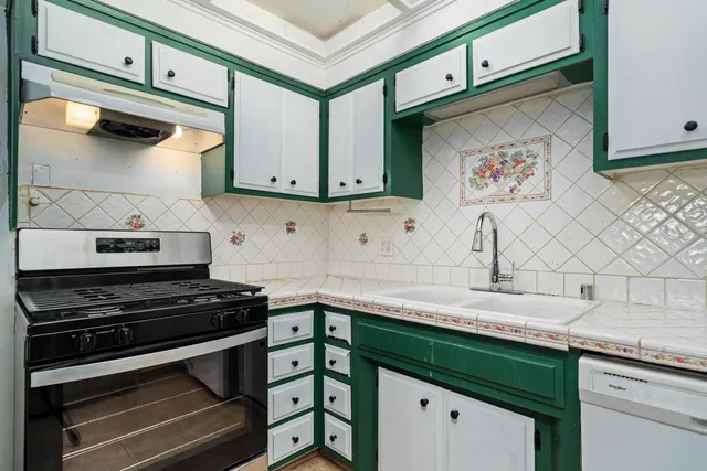 a bathroom with a double vanity sink a mirror and a shower