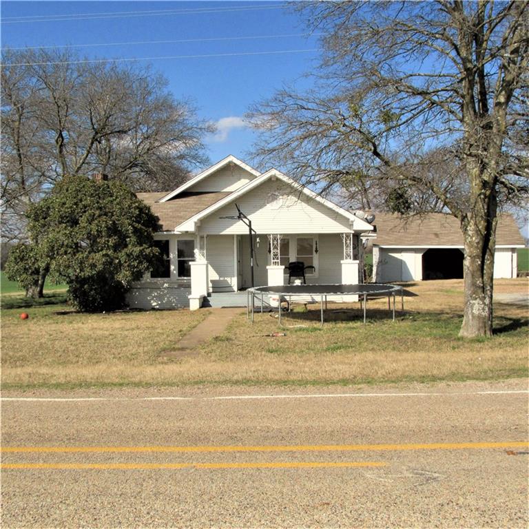 a house with trees in front of it