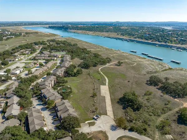 an aerial view of ocean with residential house with outdoor space