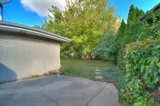 a backyard of a house with lots of green space