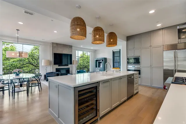 a large kitchen with a table and chairs in it