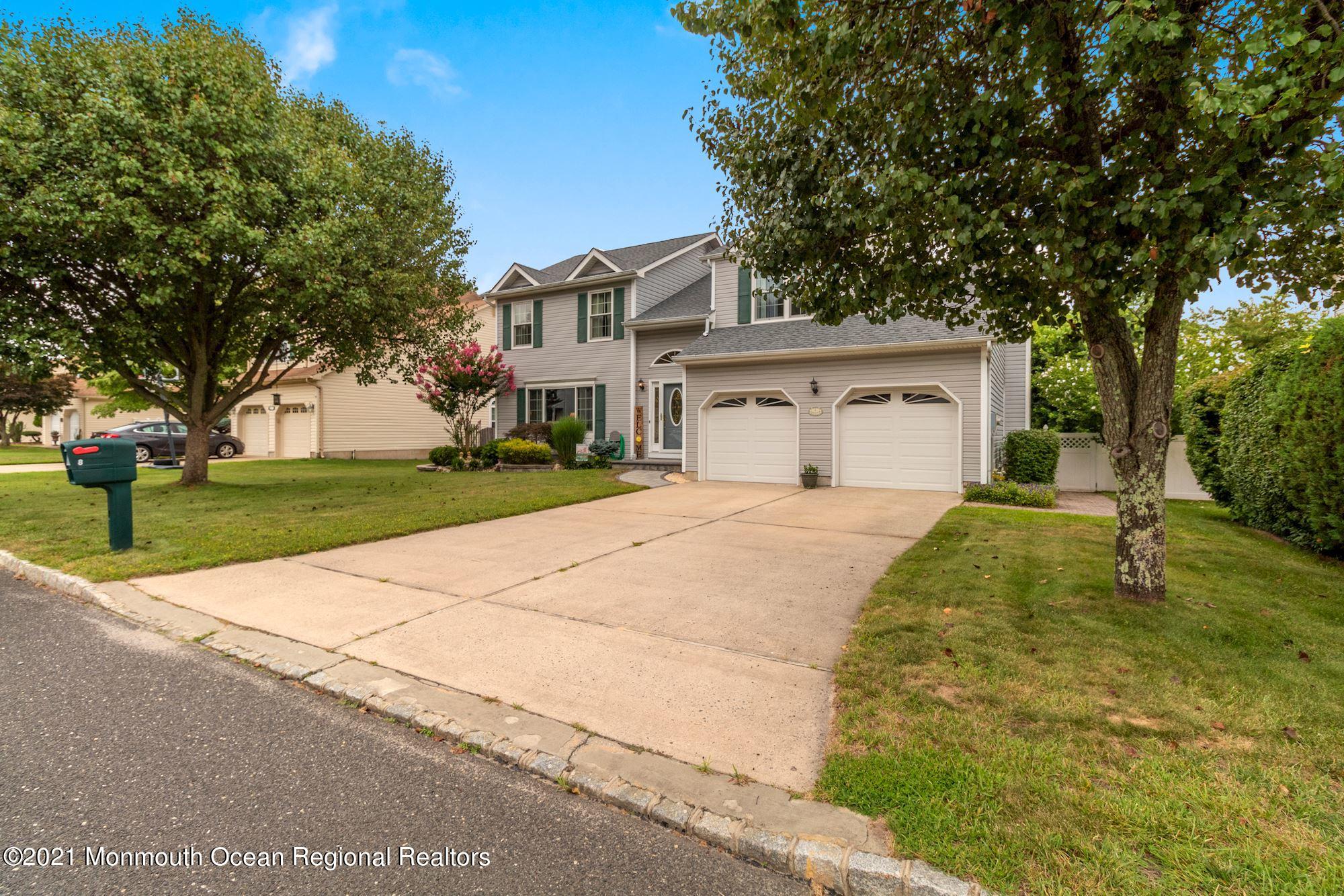 8 Derringer Drive Howell, NJ 07731 - Photo 2 of 33 a white house with a tree in front of it